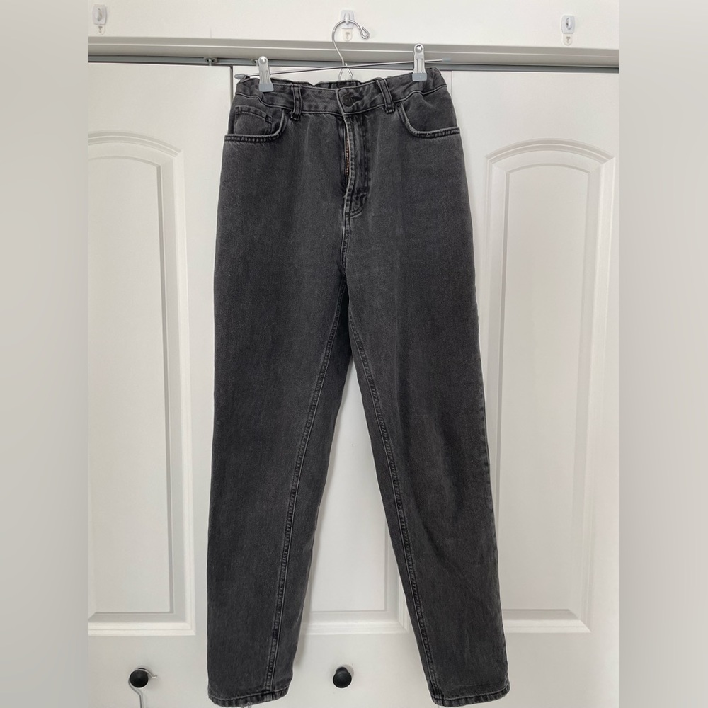 Black slightly distressed mom jeans. Size 29 with stretchy waistband. High rise